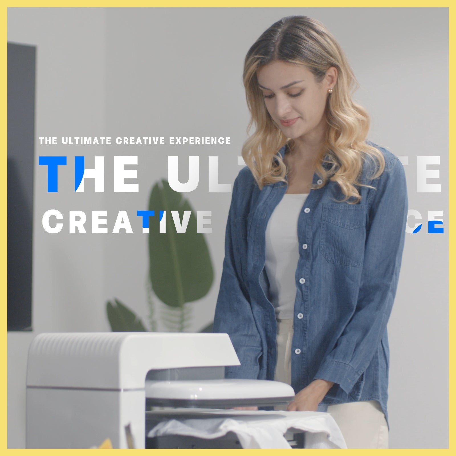 Woman using auto heat press 1 with text overlay 'The Ultimate Creative Experience' in an office setting.